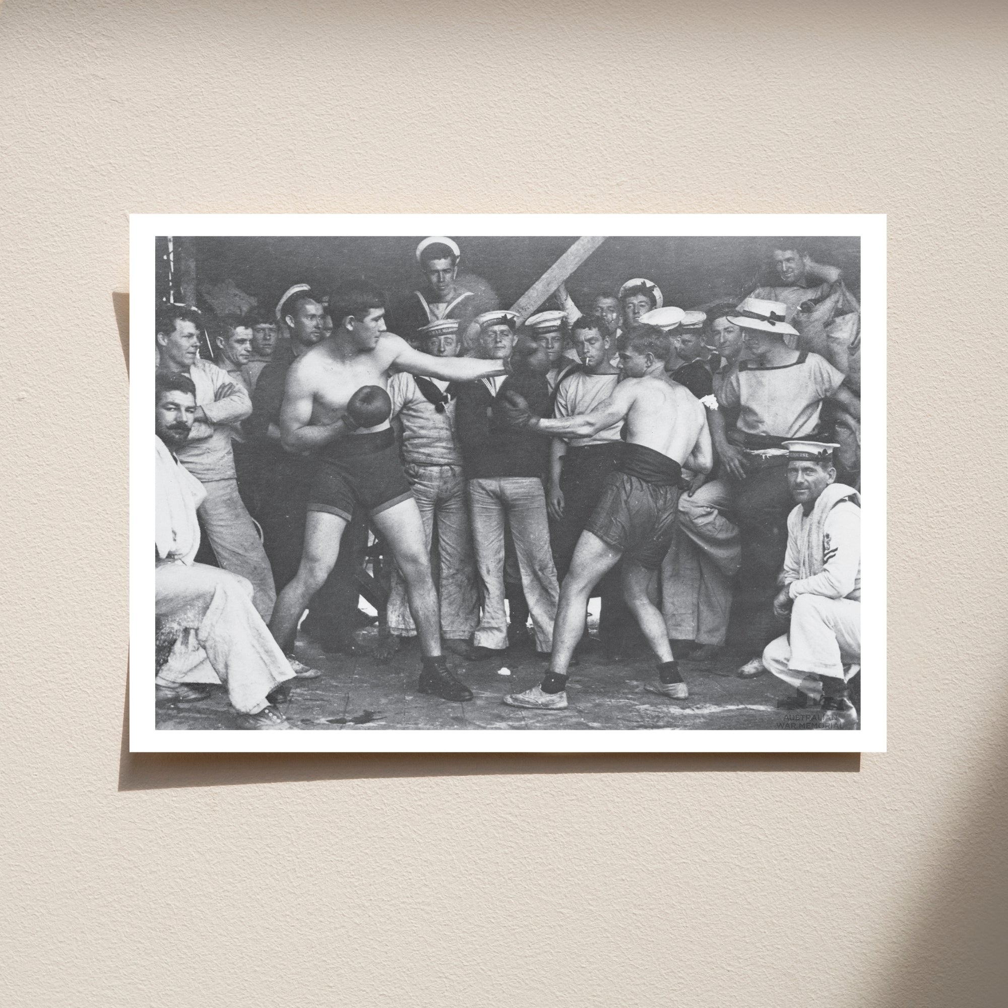 Postcard: Unidentified sailors watch a boxing match aboard HMAS Melbourne