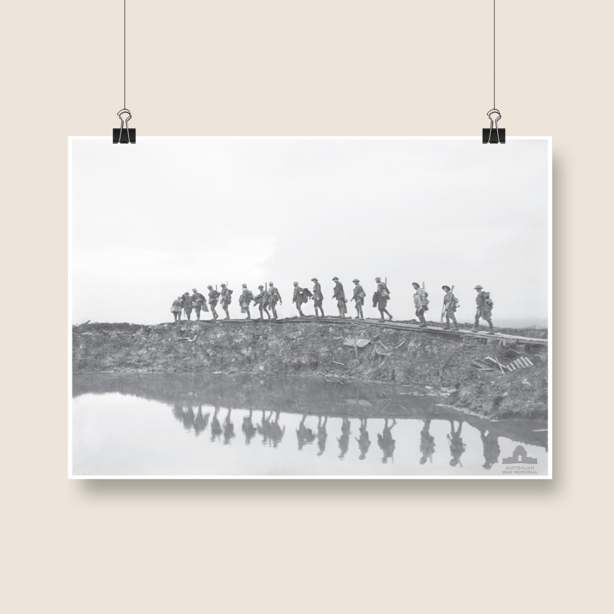 Poster mock-up of Frank Hurley's photograph - Supporting troops of the 1st Australian Division walking on a duckboard track near Hooge, in the Ypres Sector. 1917. From the collection of the Australian War Memorial - E00833.