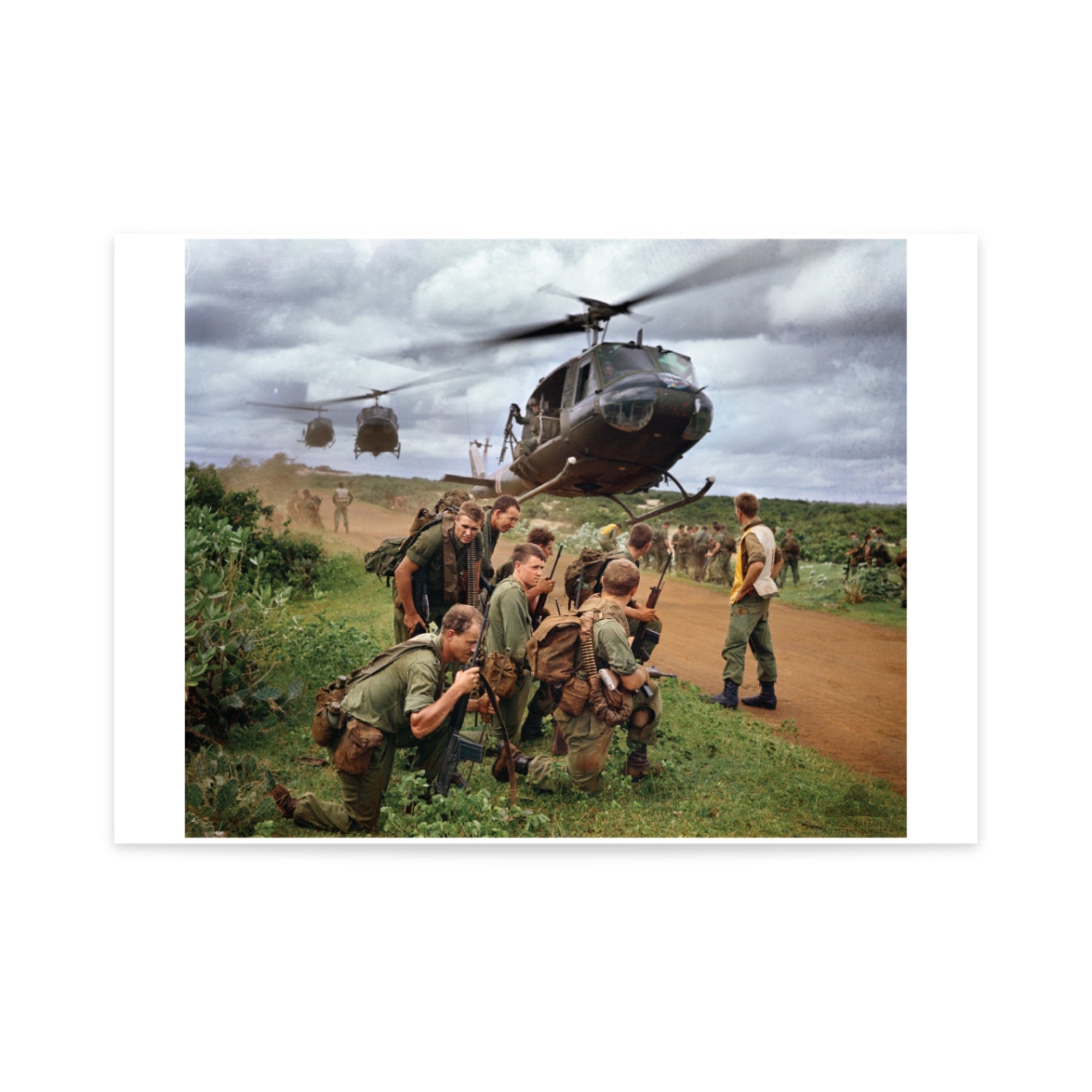 Poster mock-up of Michael Coleridge's photograph - Members of 5 Platoon, B Company, 7RAR, waiting for an Iroquois, near Lang Phuoc Hai, Vietnam. 1967. From the collection of the Australian War Memorial - EKN/67/0130/VN.
