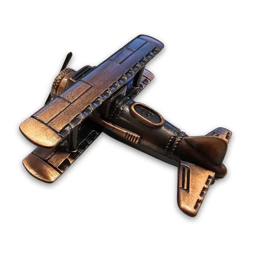 Bronze airplane model on a white background