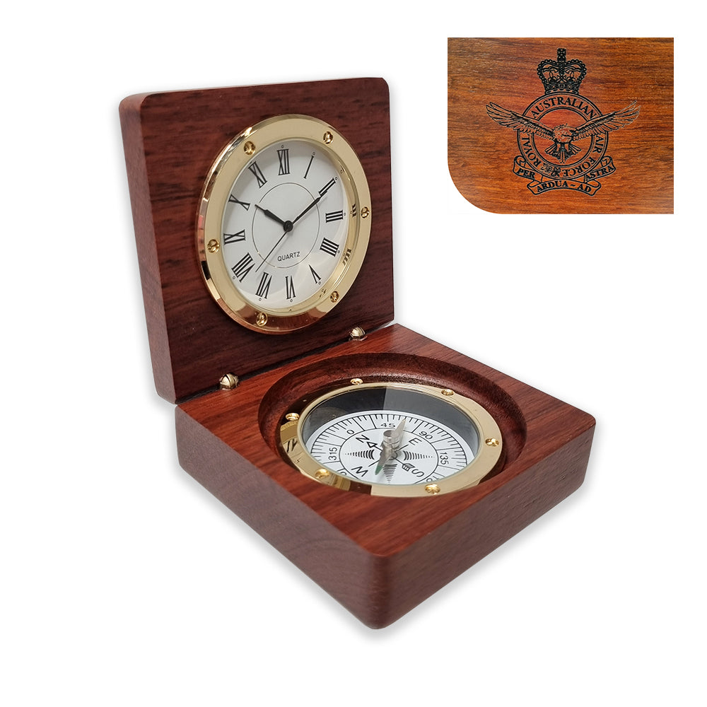A clock and compass desk set crafted from wood, with the clock's cover featuring the Royal Australian Air Force crest.