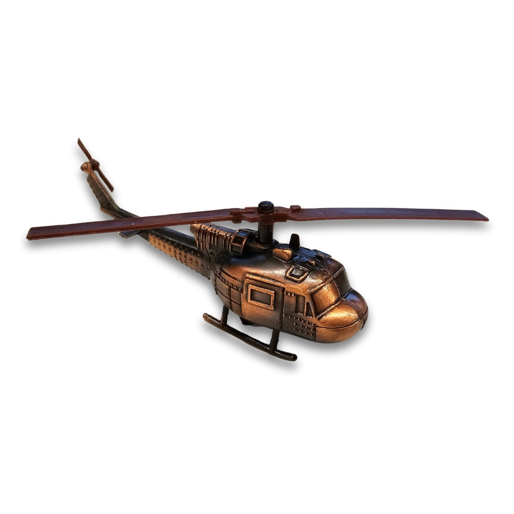 Bronze helicopter figurine on a white background
