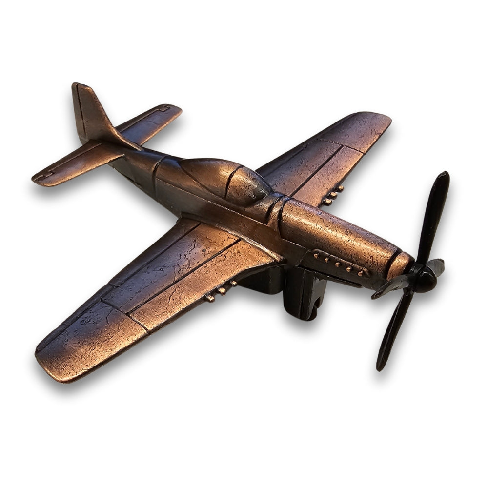 Bronze airplane model on a white background
