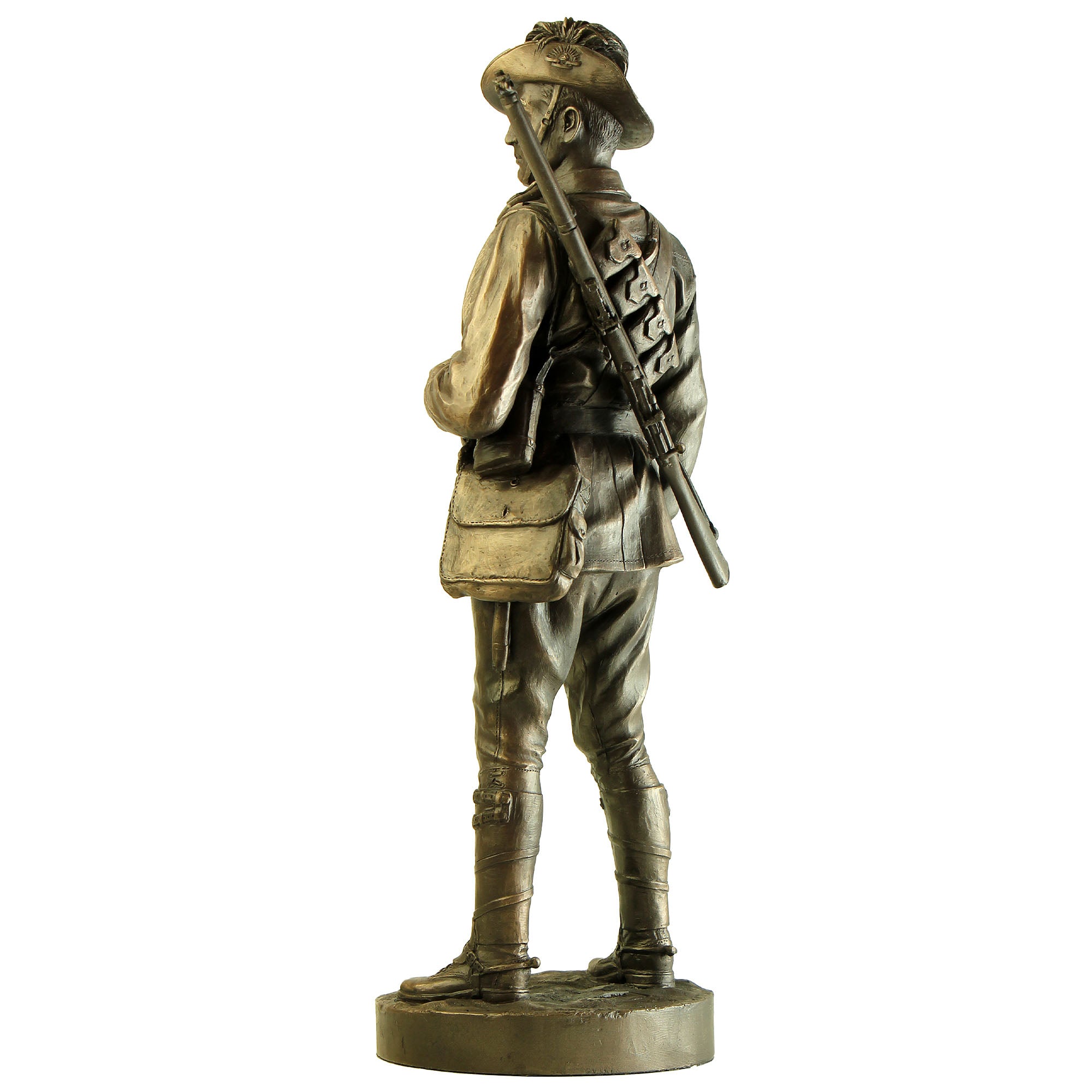 Bronze statue of a soldier holding a rifle on a white background