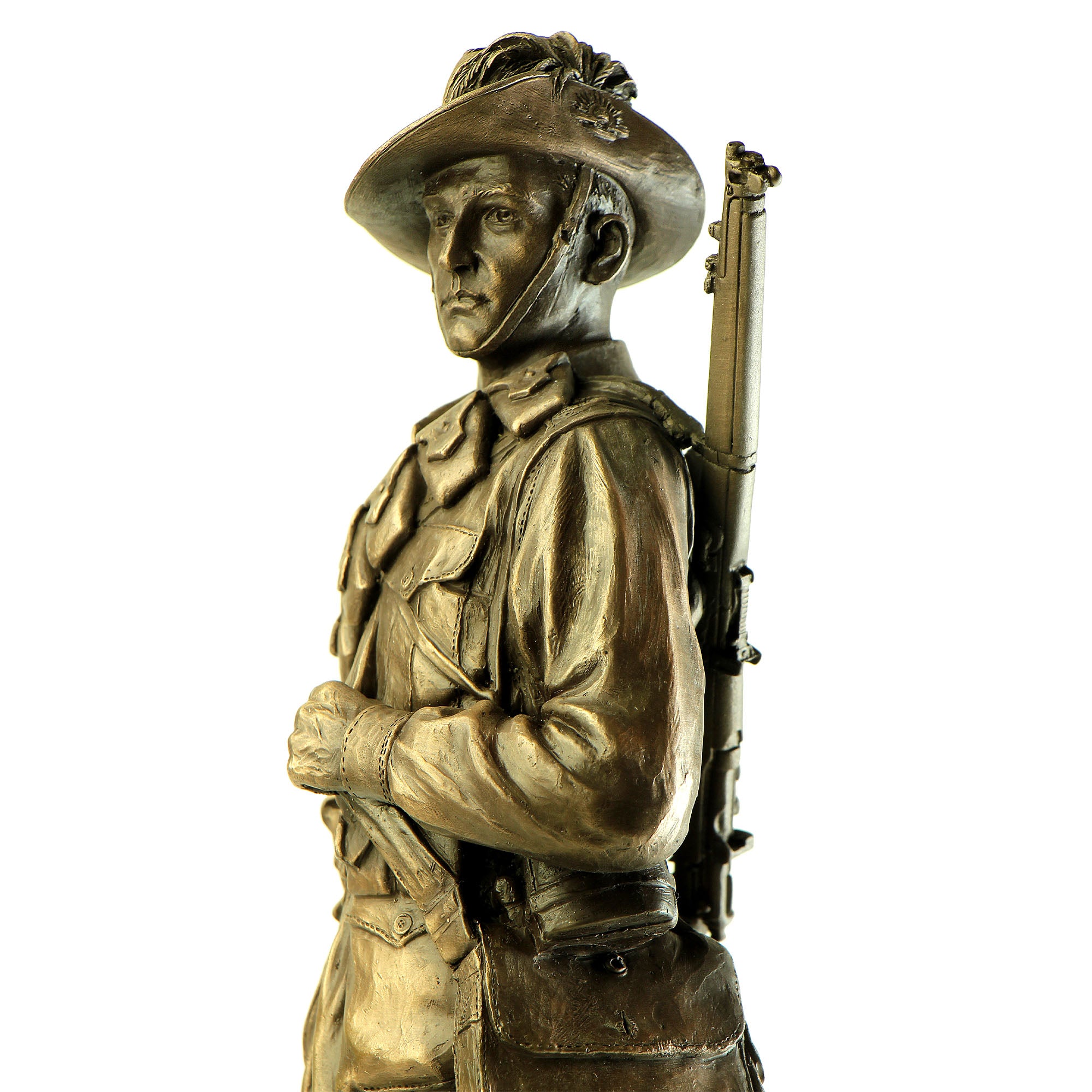 Bronze statue of a soldier holding a rifle on a white background