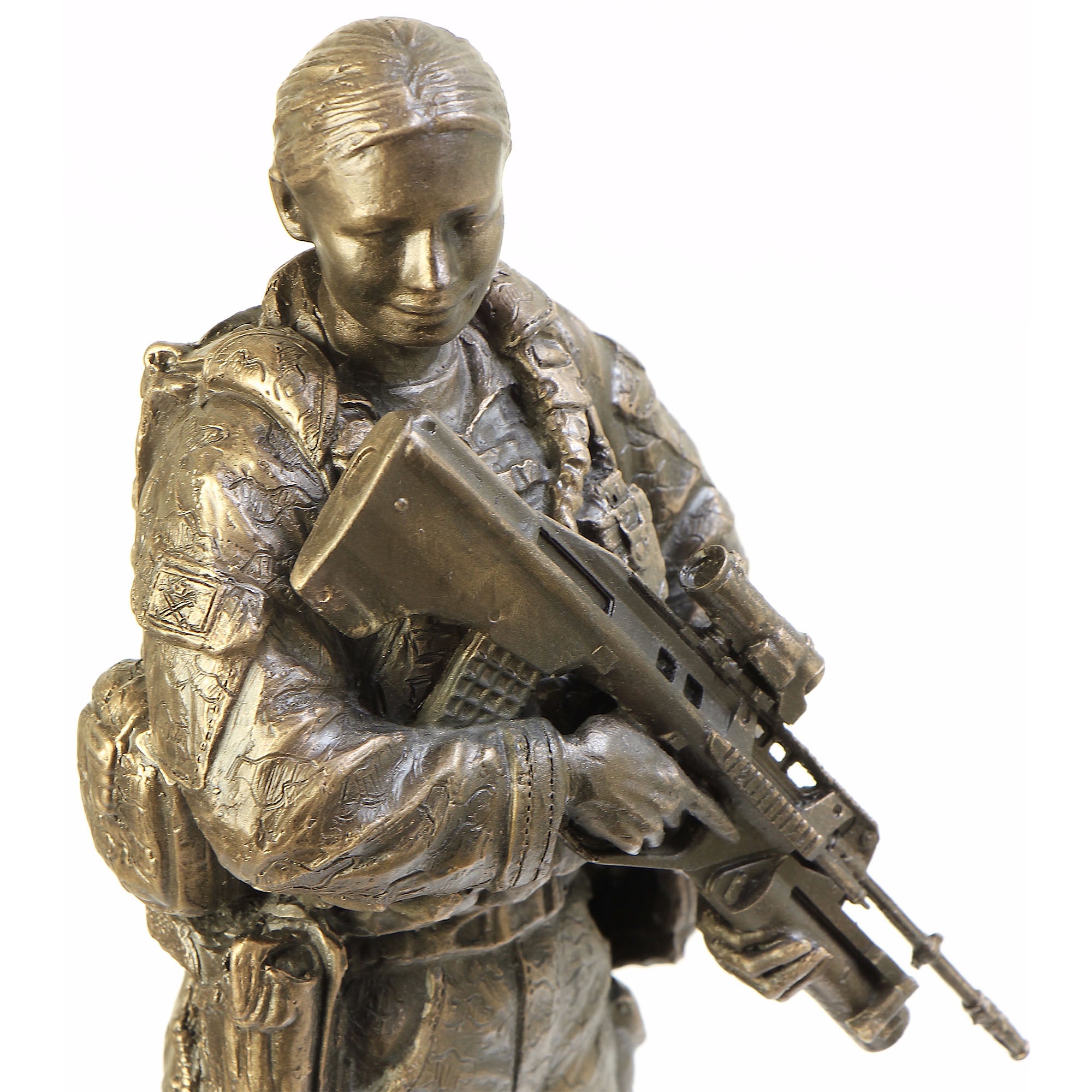 Bronze statue of a soldier holding a rifle on a white background