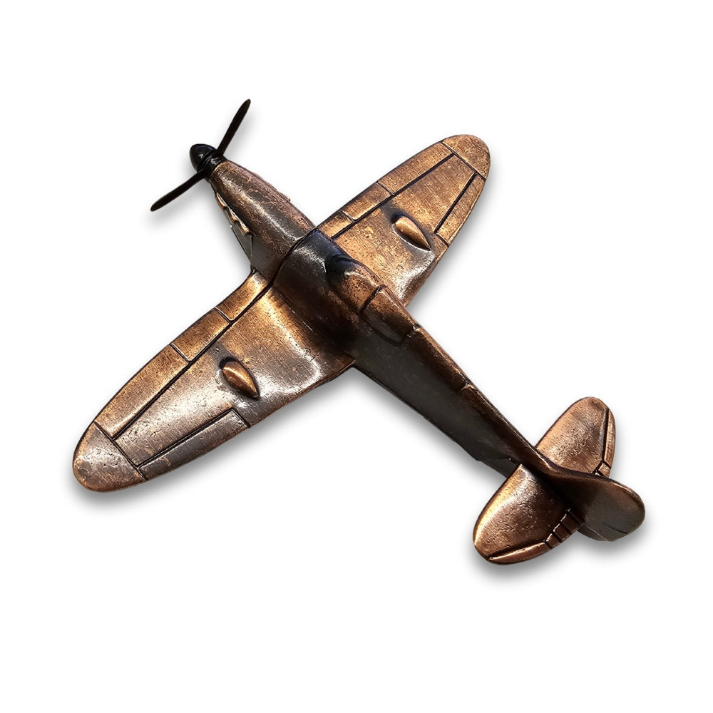 Bronze airplane model on a white background