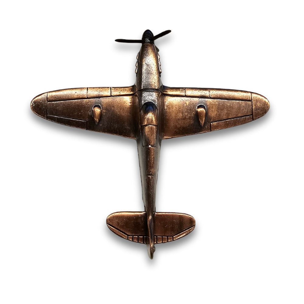 Bronze airplane model on a white background