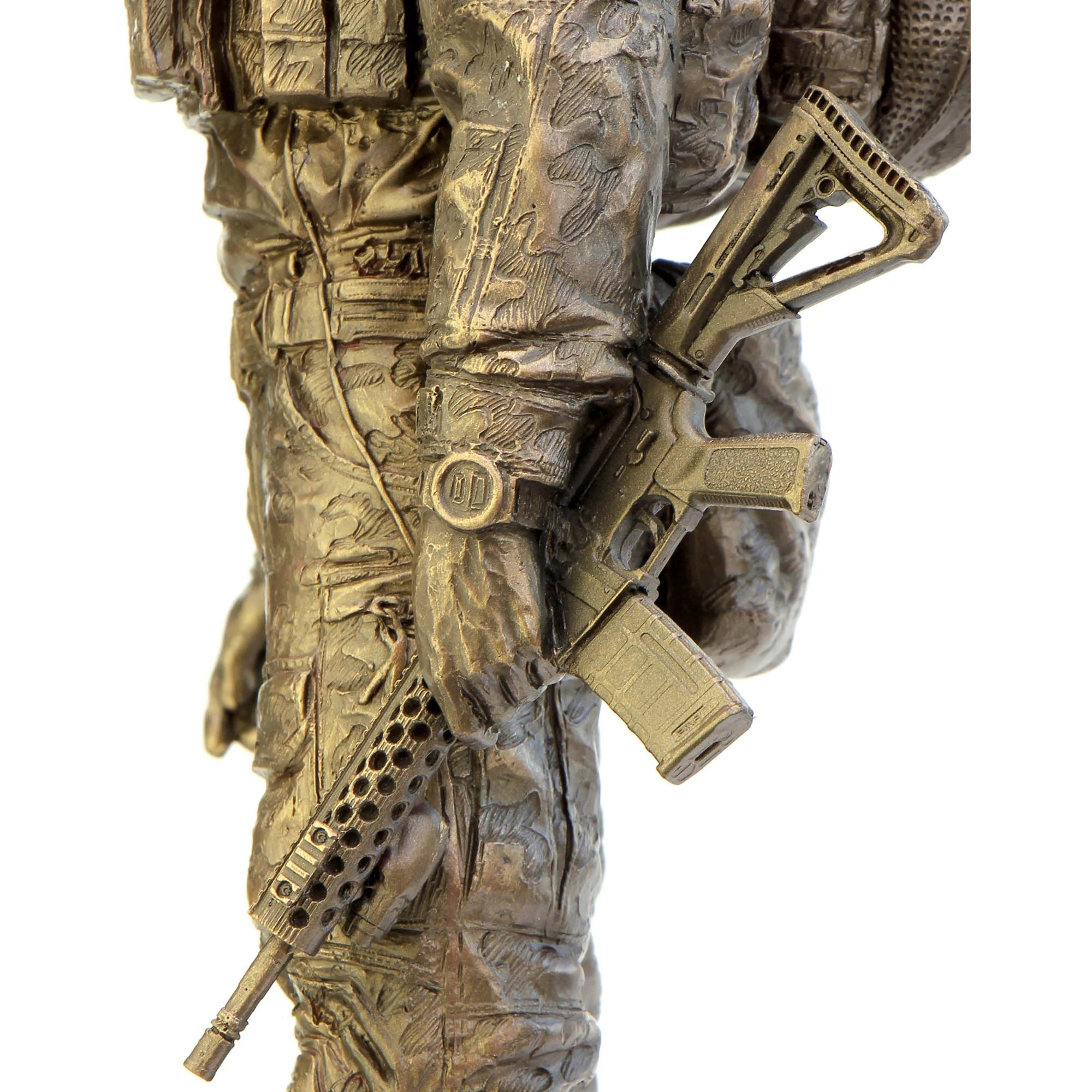 Bronze statue of a soldier holding a rifle on a white background