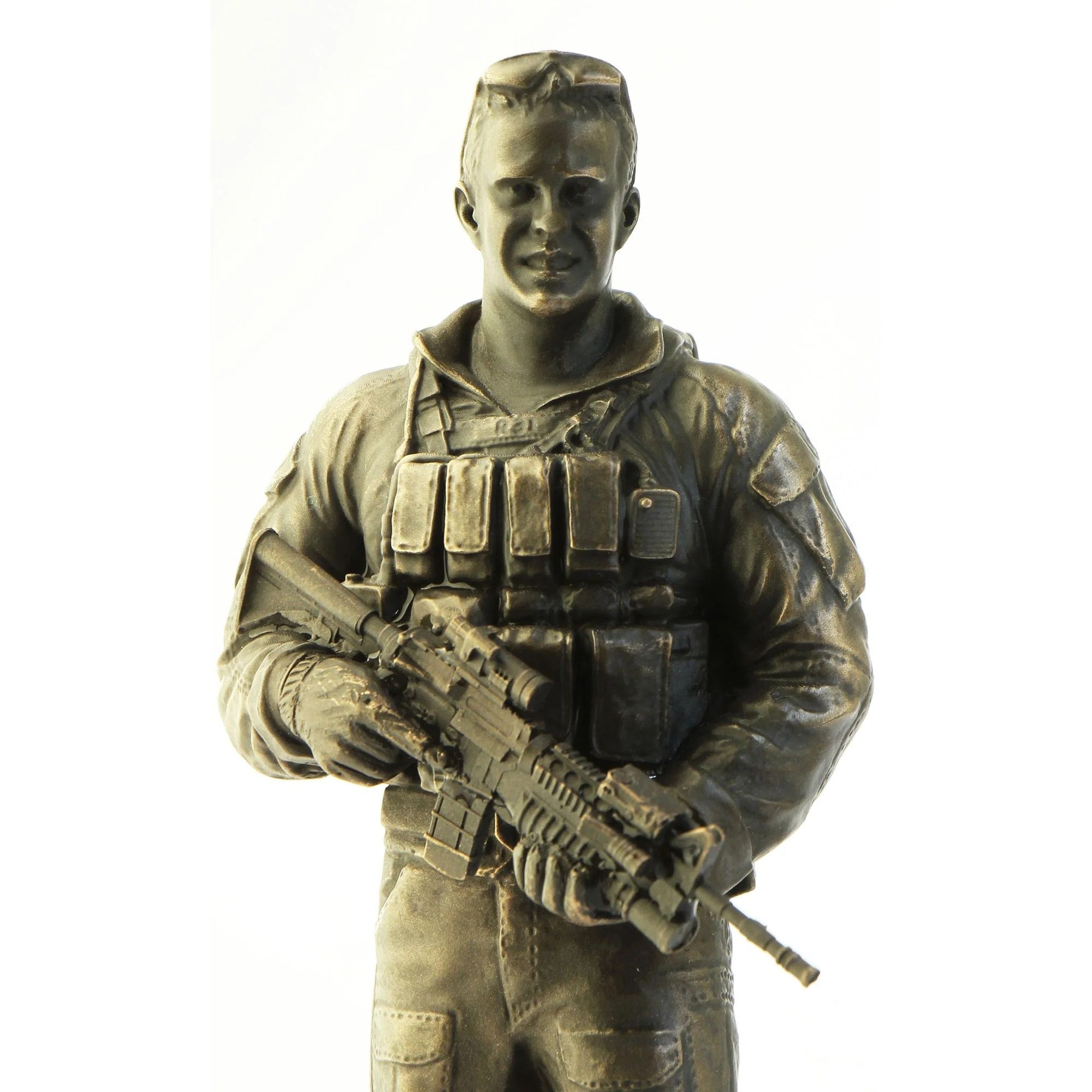 Bronze statue of a soldier holding a rifle on a white background