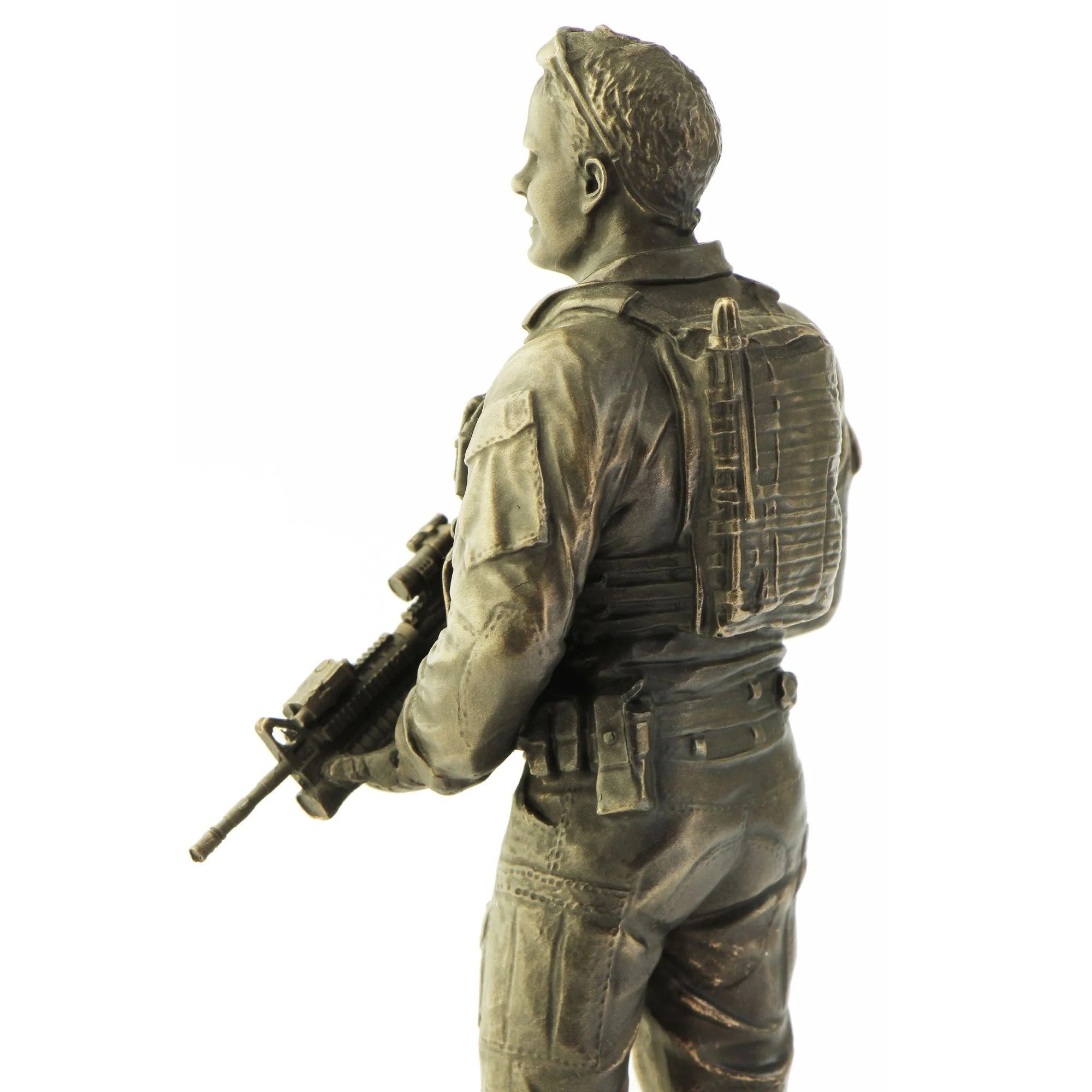 Bronze statue of a soldier holding a rifle on a white background