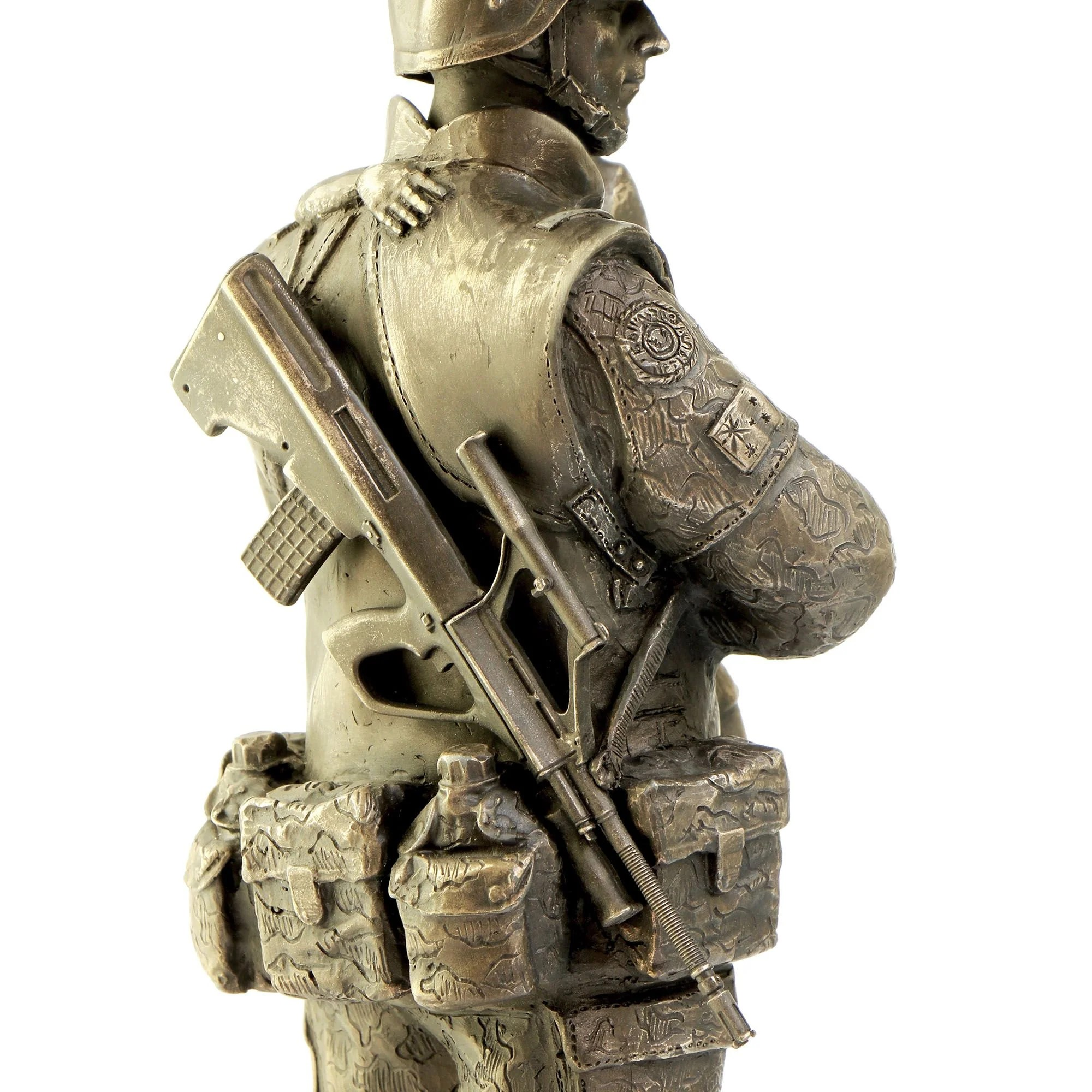Bronze statue of a warrior holding a rifle on a white background