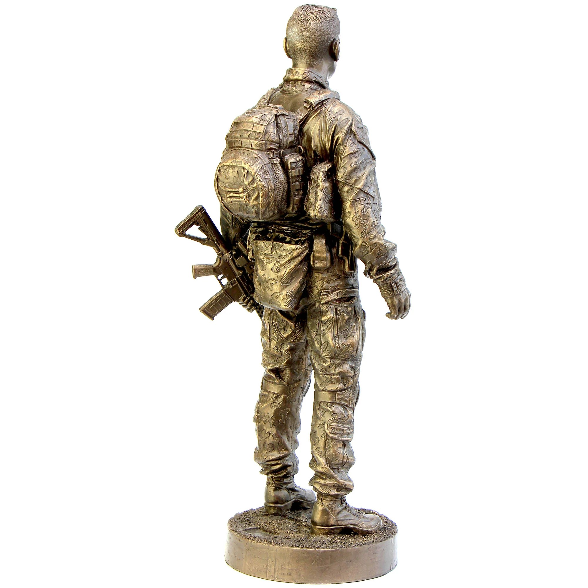 Bronze statue of a soldier with a rifle and backpack on a white background