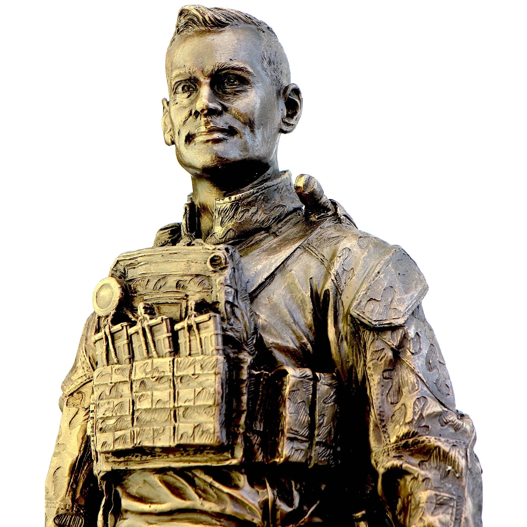 Bronze statue of a person wearing tactical gear on a white background