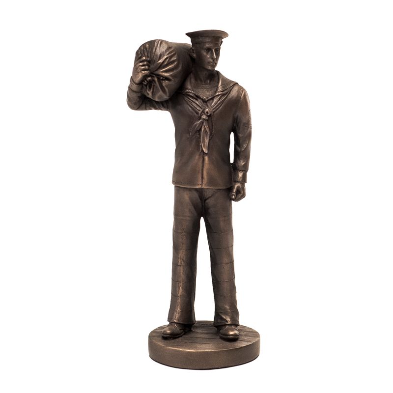 Bronze statue of a sailor with a bag on his shoulder on a white background