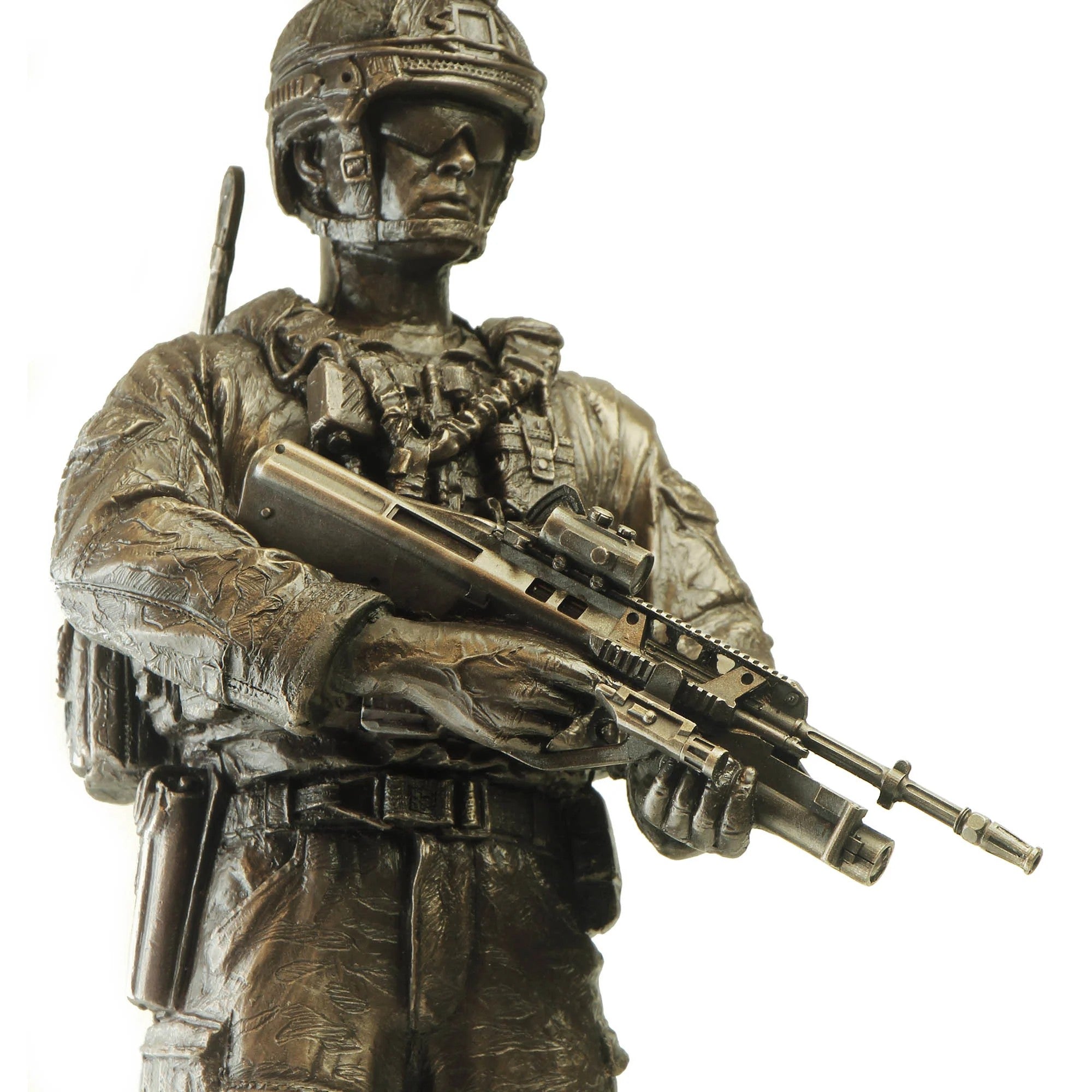 Bronze statue of a soldier holding a rifle on a white background