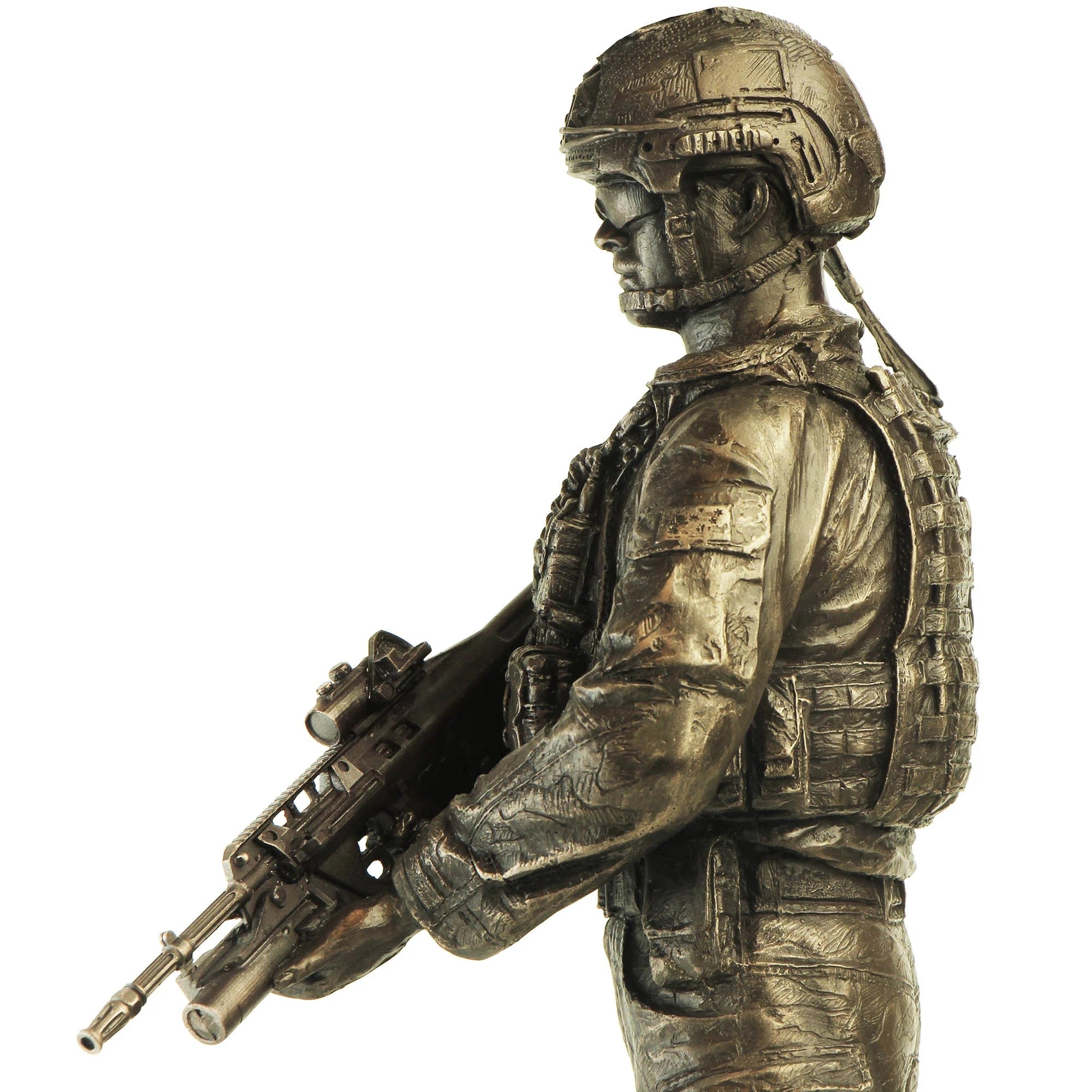 Bronze statue of a soldier holding a rifle on a white background