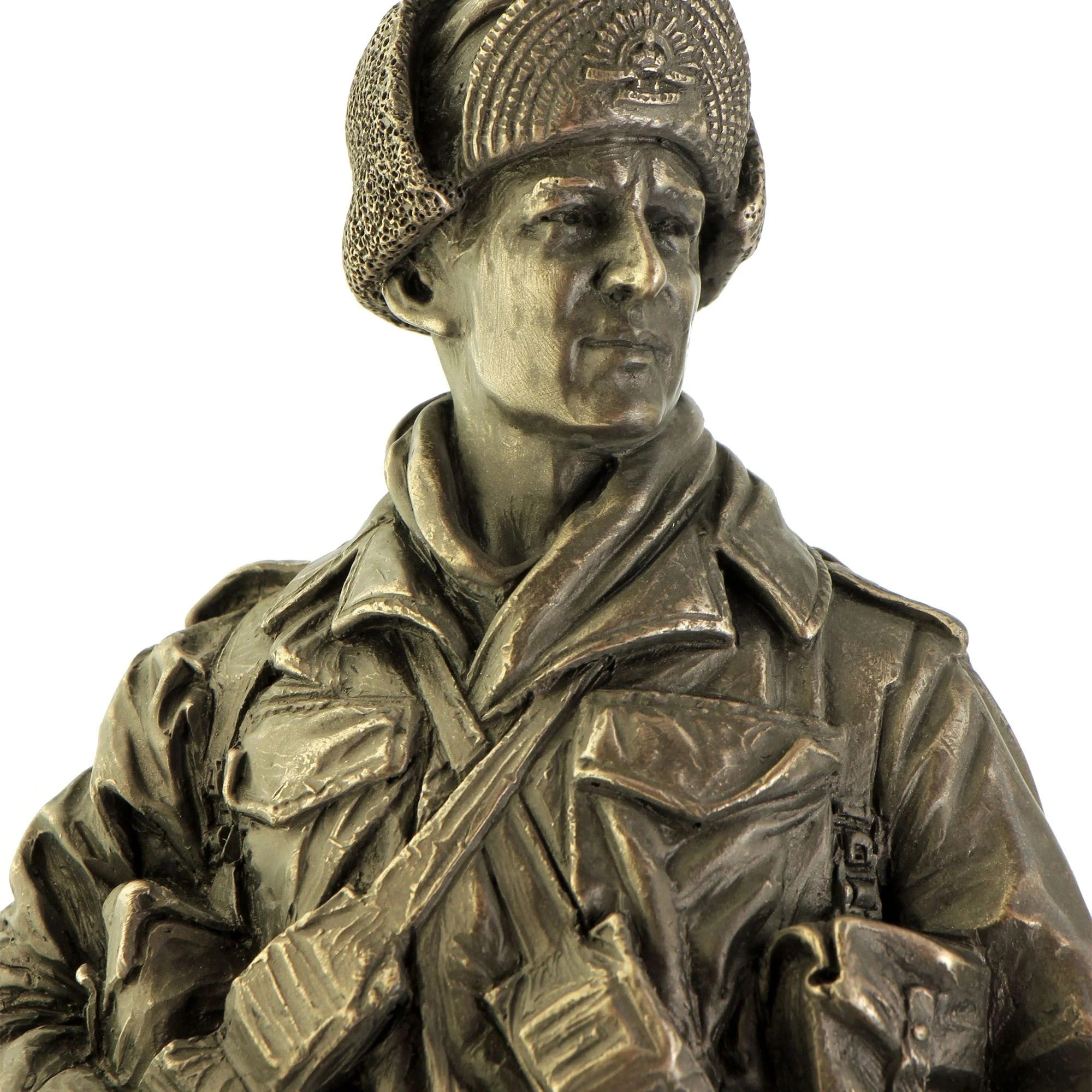 Bronze statue of a soldier with a helmet and rifle on a white background