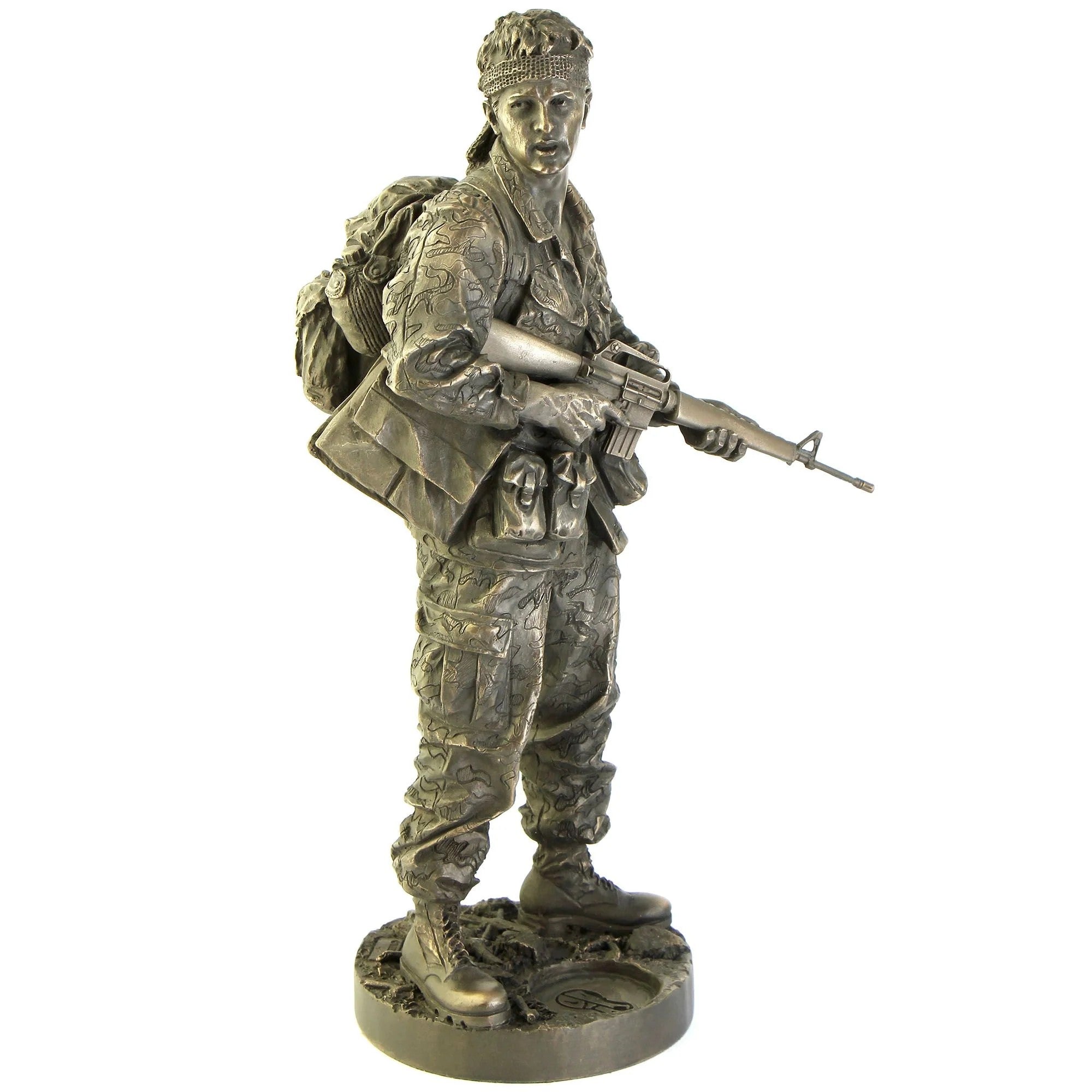 Bronze statue of a soldier holding a rifle on a white background