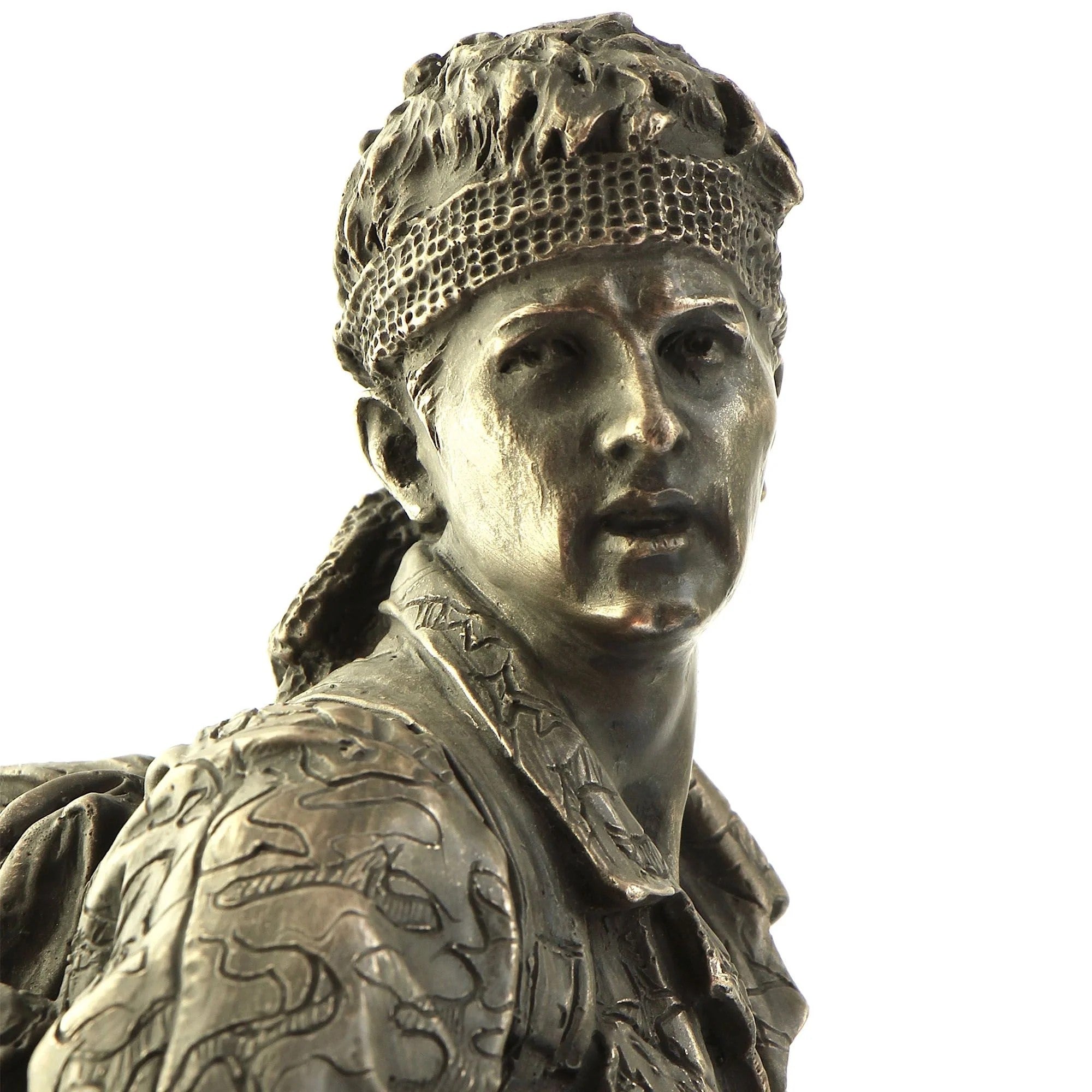 Bronze statue of a warrior with detailed armor and headgear on a white background