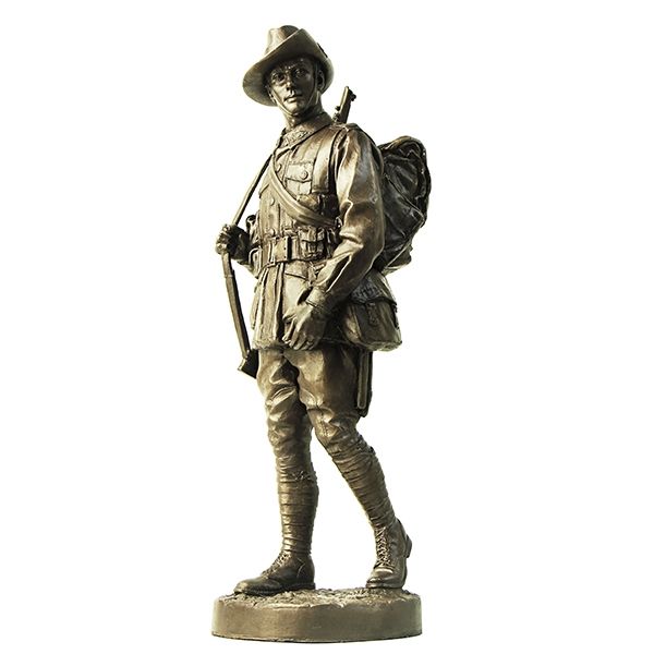 Bronze statue of a soldier with a hat and backpack on a white background